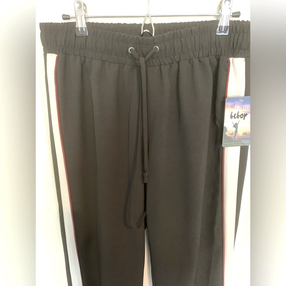 Womens black slacks with color block details on sides, size M, new